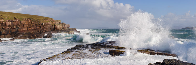 Waves crashing over rocky coastline near Point of Stoer, Assynt, North west Scotland, October